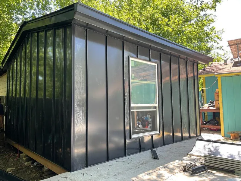 Black standing seam metal wall panels for Metal Roof Installation in Rockton