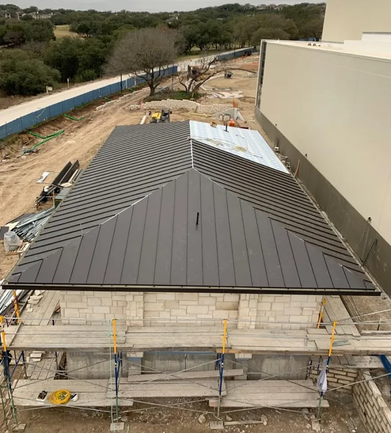 Metal roof new construction with scaffolding in Rockton